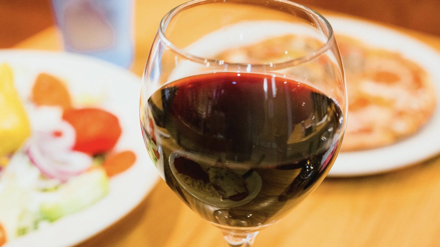 A glass of red wine on the table at Luigi's