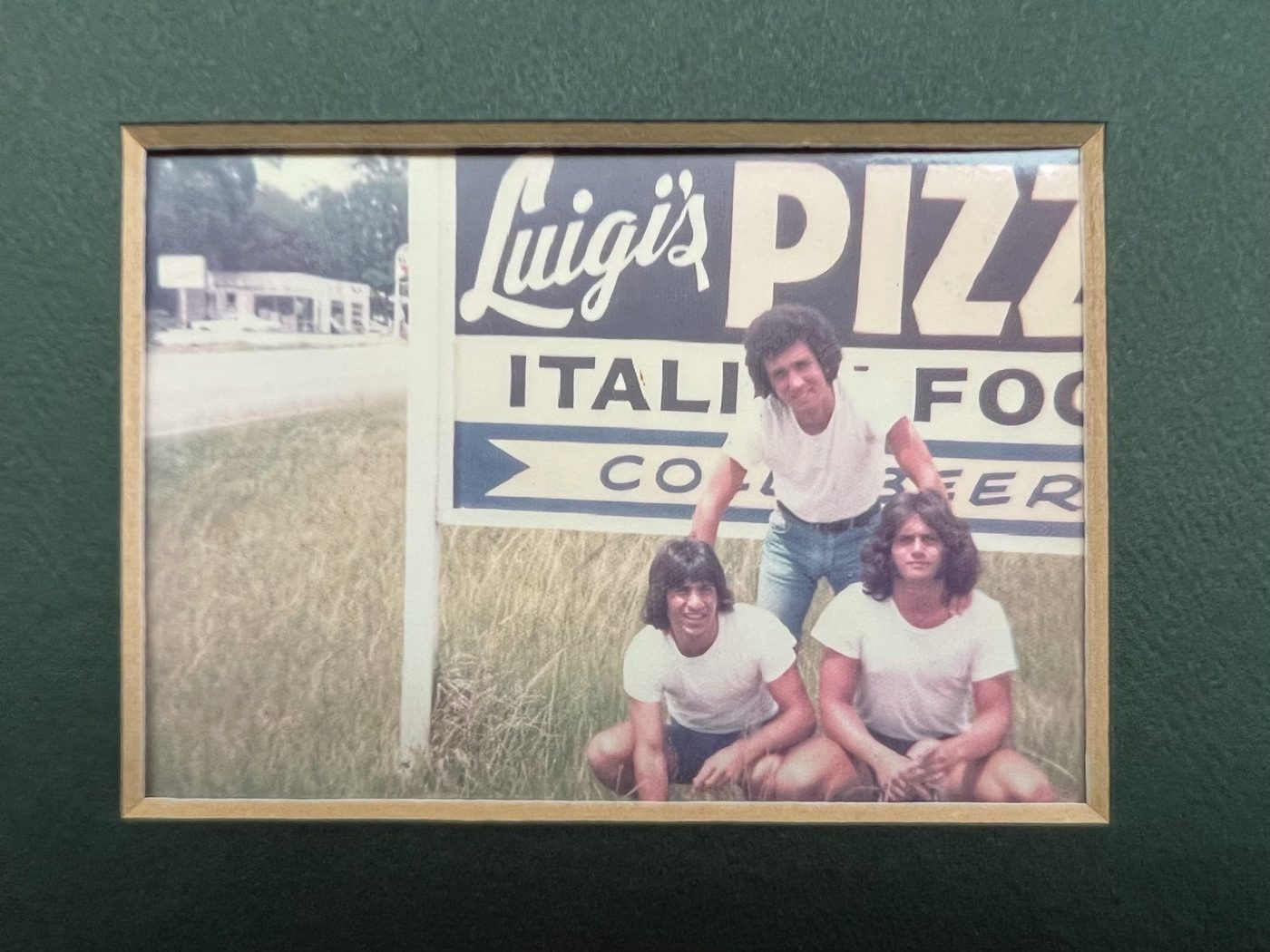George Kirshy Sr, Sunny Grosso and Michael Buono at the original Luigi's Pizza sign at Hernando Plaza in 1970